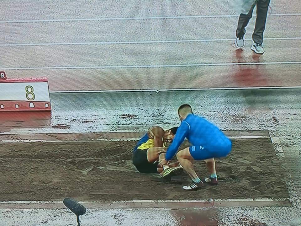 Greek athlete helping injured Abdul Latiff